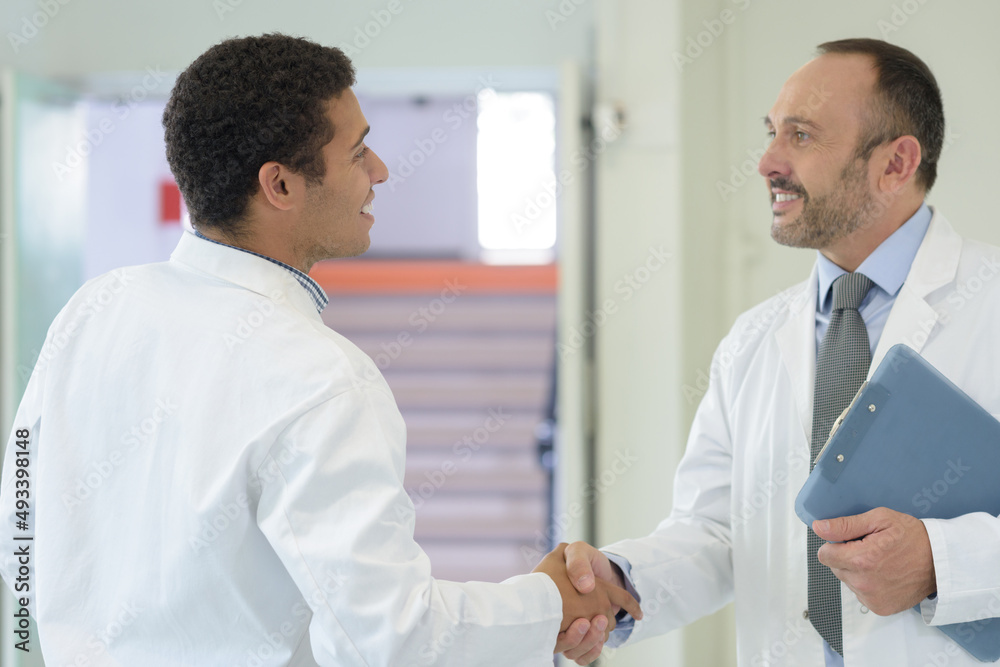 medical people handshaking at office medical people handshaking at office