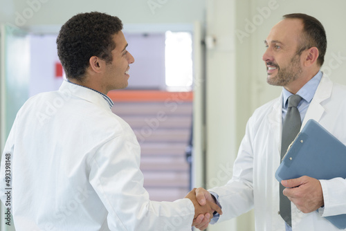 medical people handshaking at office © auremar