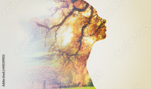 In touch with nature. Composite image of nature superimposed on a womans profile.