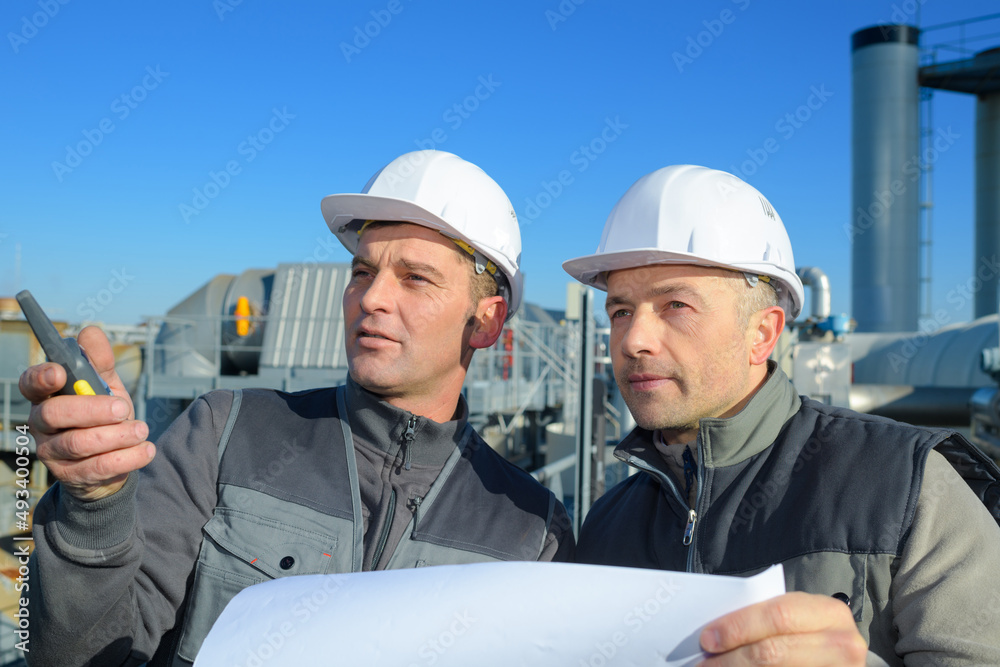 team of construction engineers looking at the site team of construction engineers looking at the site