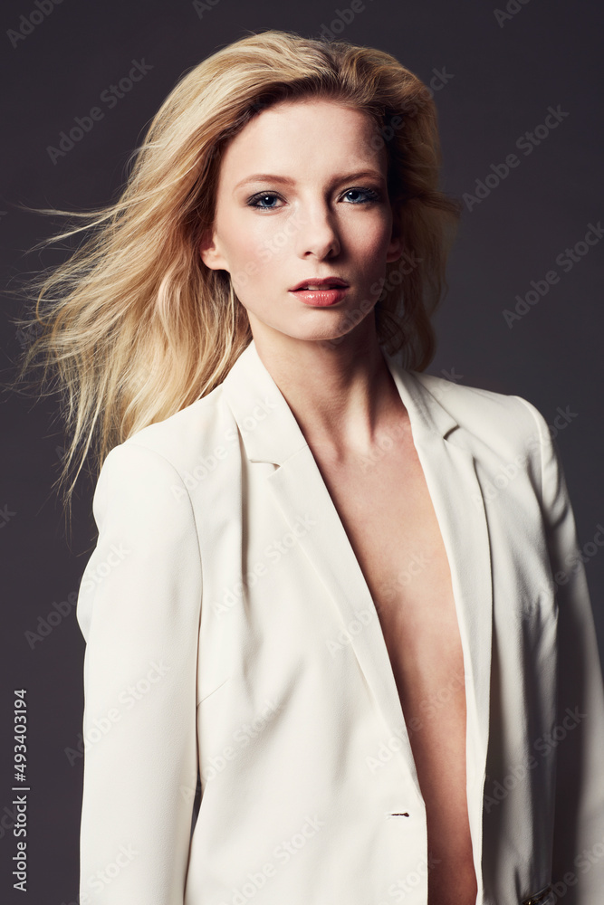 Her style is effortlessly chic. Portrait of an attractive and stylish young woman posing in the studio. Her style is effortlessly chic. Portrait of an attractive and stylish young woman posing in the studio.