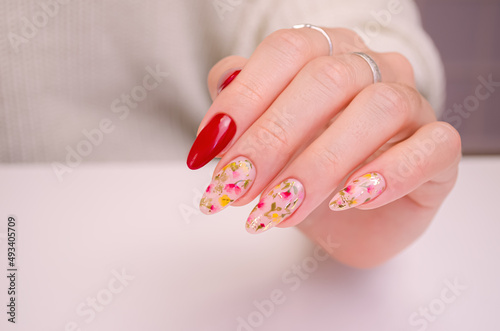 Beautiful female hand with spring manicure