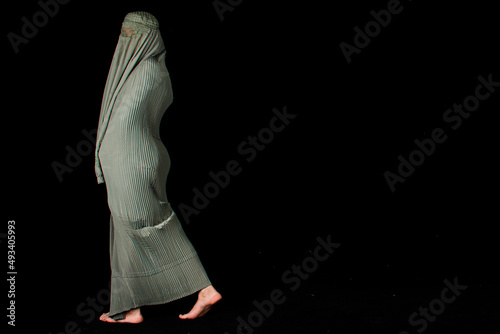 a person with a gun
Afghan girl, Afghan woman, Afghan tent 