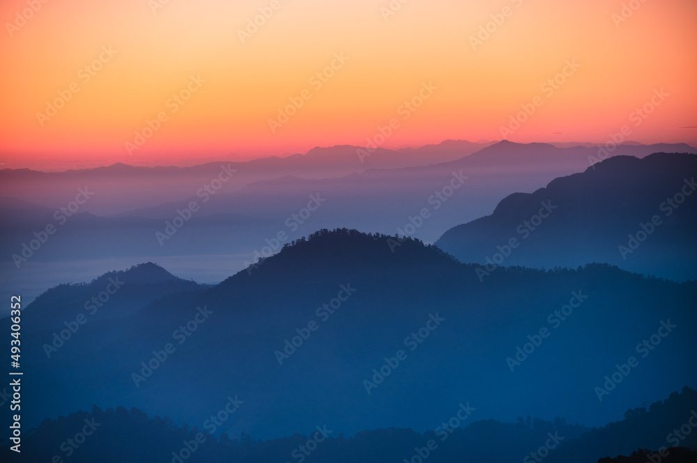 Colorful sky with mountain layers in the morning