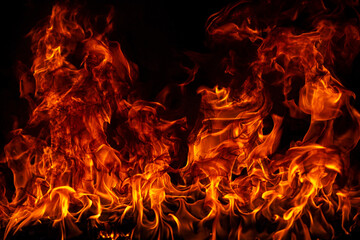 Fire blaze flames on black background. Fire burn flame isolated, abstract texture. Flaming explosion with burning effect. Fire wallpaper, abstract art pattern with copy space.