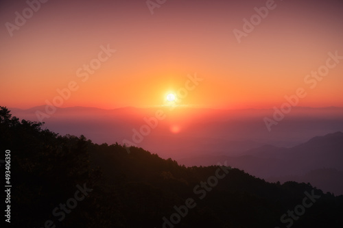 Sunrise over mountain with colorful sky in tropical rainforest at national park in the morning © Mumemories