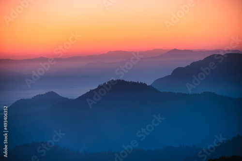 Colorful sky with mountain layers in the morning