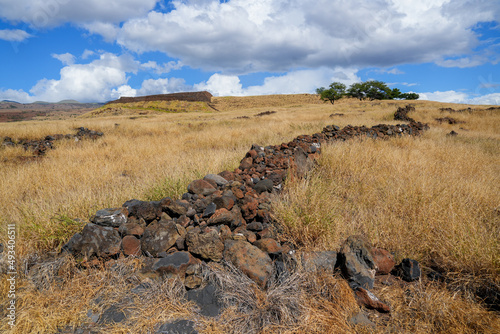 Remains of an ancient wall in what was a village in the Pu'ukohola Heiau National Historic Site on the Big Island of Hawai'i in the Pacific Ocean photo