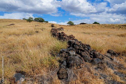 Remains of an ancient wall in what was a village in the Pu'ukohola Heiau National Historic Site on the Big Island of Hawai'i in the Pacific Ocean photo