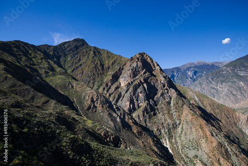 Rocky mountains with blue sky in Yunnan province © okonato