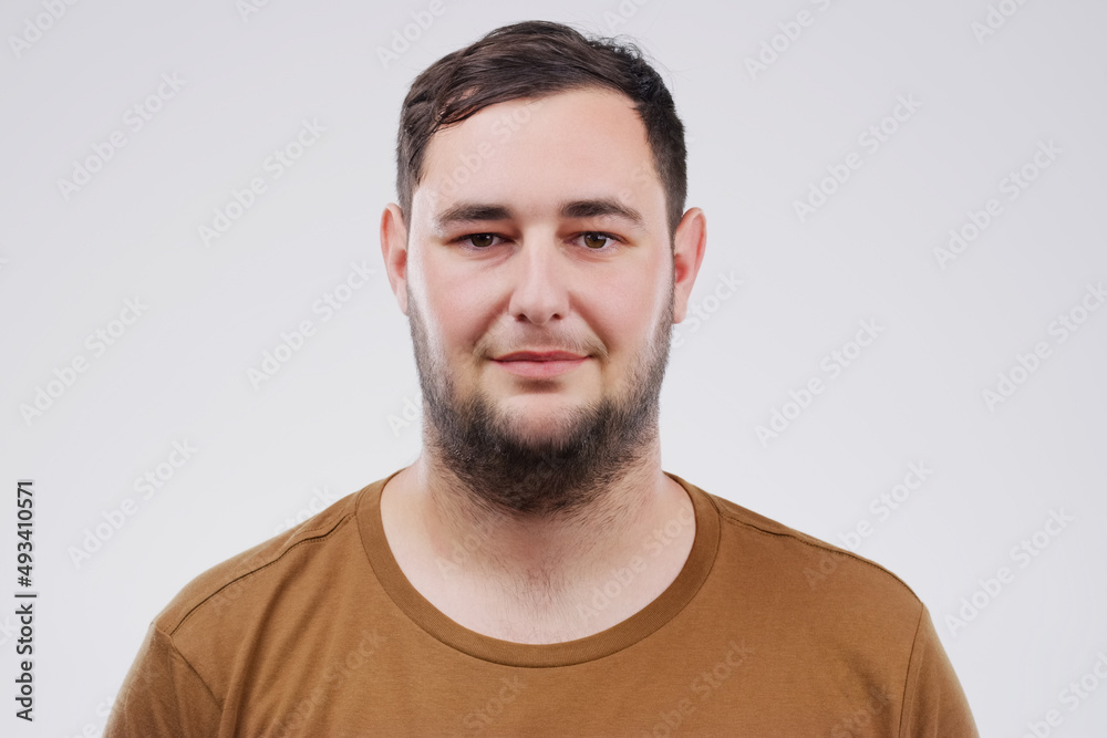 Ive got a lot to smile about. Studio portrait of a handsome young man smiling against a grey background. Ive got a lot to smile about. Studio portrait of a handsome young man smiling against a grey background.