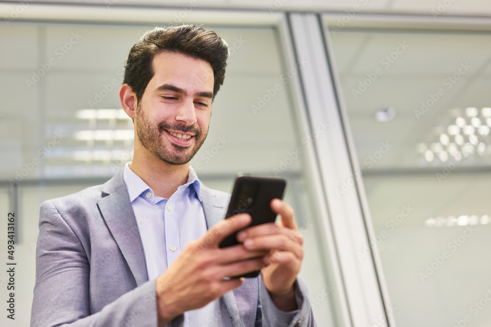 Business man reading a text message on the smartphone Business man reading a text message on the smartphone