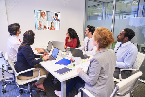 Business meeting with video conference in the office and remote