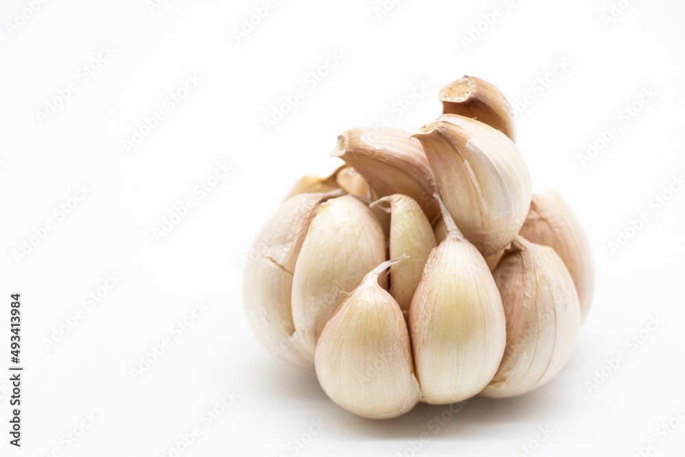 Fresh peeled garlic cloves, bulb with garlic slices isolated on white background. Fresh peeled garlic cloves, bulb with garlic slices isolated on white background.