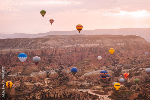 Travel in Cappadocia Colorful hot air balloons flying over the valley sunrise time with special breakfast travel destination in Turkey