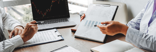 Business team meeting Strategy Planning with new startup project plan Finance and Economy Graph with laptop successful teamwork