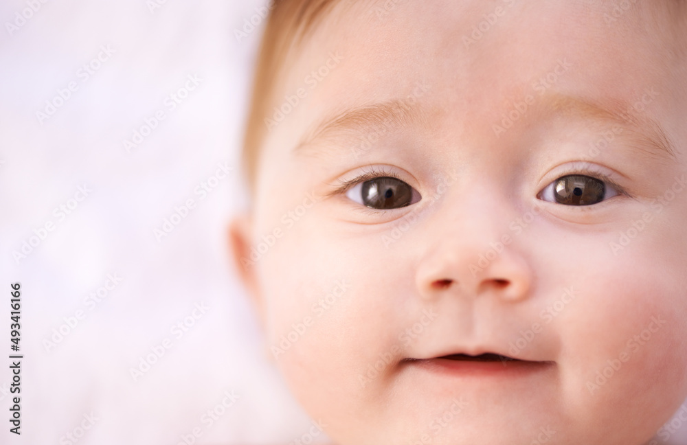 Filled with wonder at her world. Shot of an adorable baby girl with red hair.