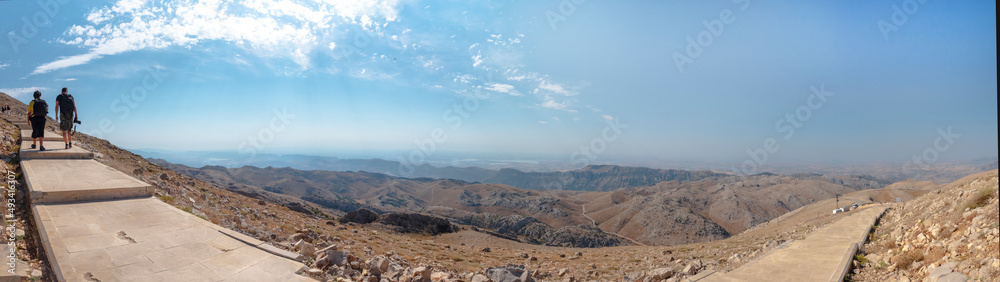 Kahta, Adiyaman Turkey - August 2021: Climbing steps to the top of the mountain Nemrut panoramic view. It takes around 300 steps to climb Nemrut Mountain which has 2.150 meters altitude.