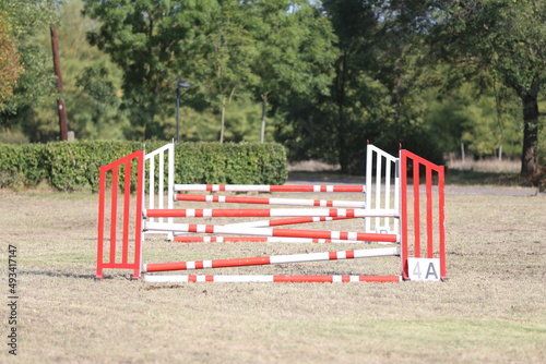 Show jumping poles obstacles, barriers, waiting for riders photo