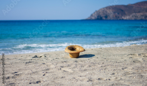Wallpaper Mural a hat on the beach blown by the wind Torontodigital.ca