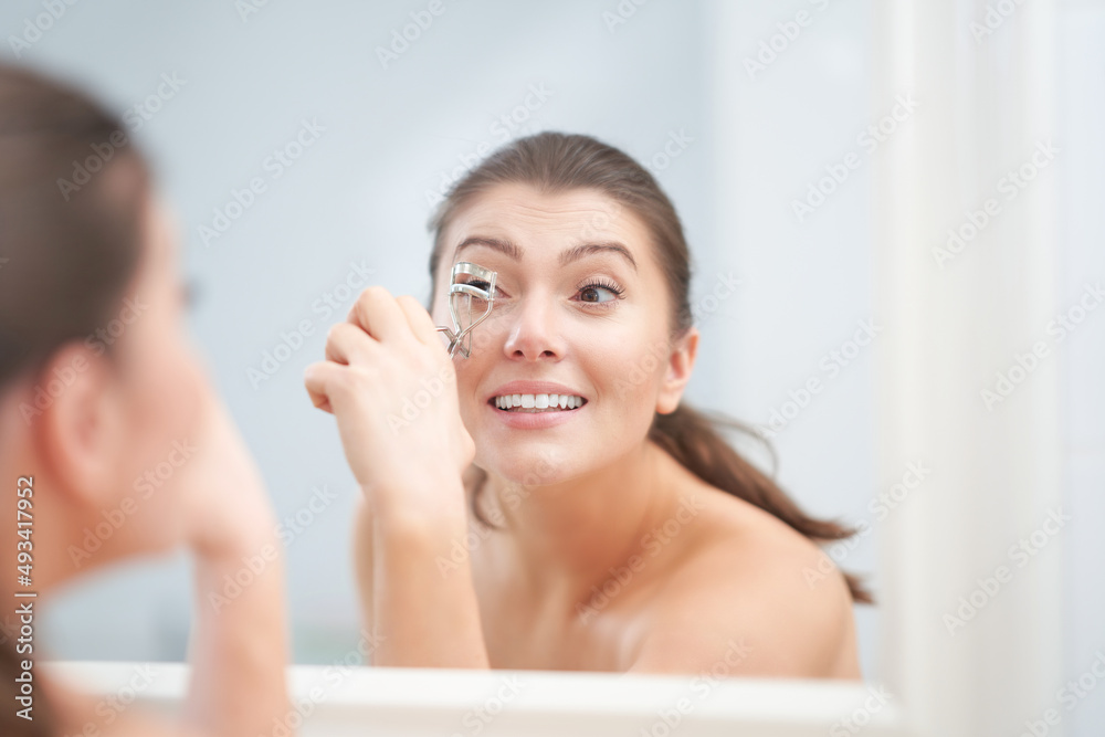 Young nice brunette woman in the bathroom Young nice brunette woman in the bathroom