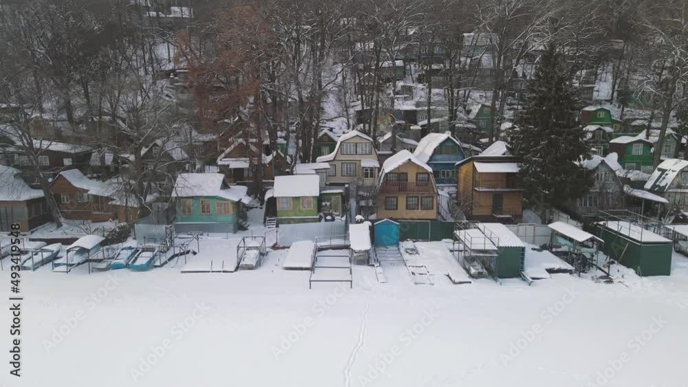 snow-covered village by the sea. 4k drone footage snow-covered village by the sea. 4k drone footage