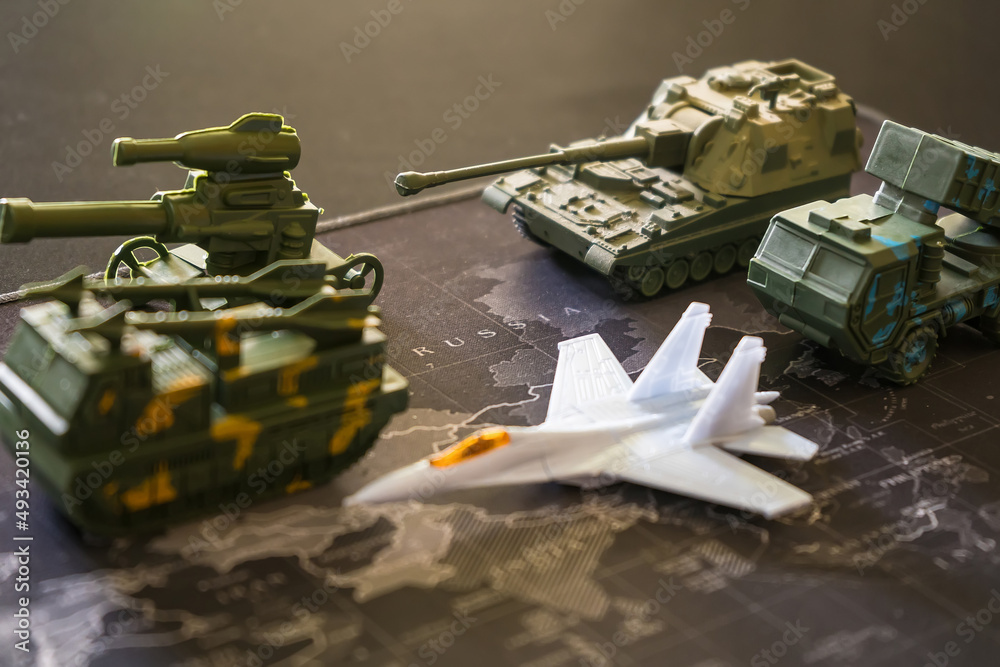 Bangkok, Thailand - March, 16, 2022 : Miniature model of military tanks and amour vehicles on the world map. Russian War of Ukraine War Concept Bangkok, Thailand - March, 16, 2022 : Miniature model of military tanks and amour vehicles on the world map. Russian War of Ukraine War Concept