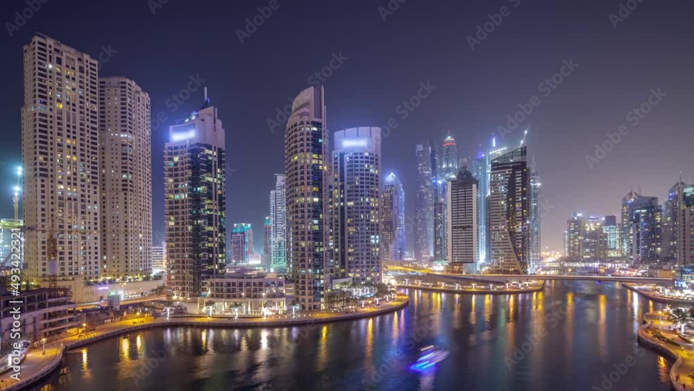 Water canal on Dubai Marina skyline at night timelapse. Water canal on Dubai Marina skyline at night timelapse.