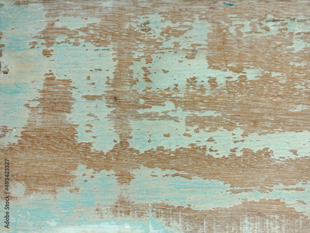 Texture of old vintage wood with peeling paint , light green color background .