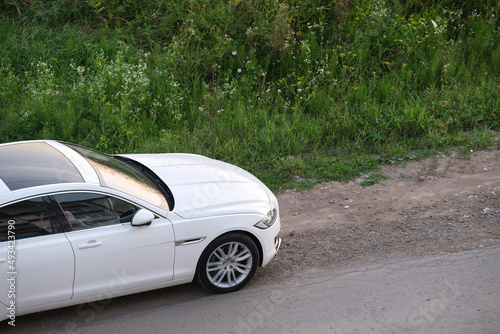 Close up of a car parked on city street side. Urban traffic concept