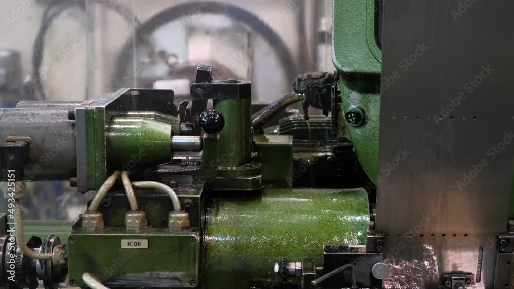 An industrial lathe processes metal. Tool manufacturing. Production of drills. An industrial lathe processes metal. Tool manufacturing. Production of drills.