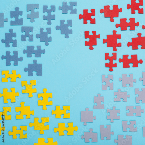 Creative design concept for April 2, Autism World Awareness day. Jigsaw colorful puzzle element, top view, flat lay.