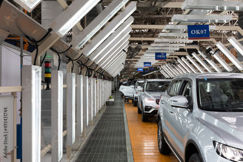 Automobile production line. Modern car assembly plant. Interior of a high-tech factory, manufacturing