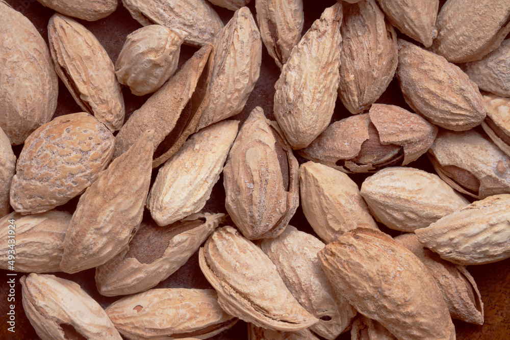 Salted almonds in a shell on a wooden background. Healthy proper nutrition, snack Salted almonds in a shell on a wooden background. Healthy proper nutrition, snack
