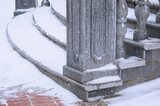 A close view of the granite steps under the snow. Balustrade sta
