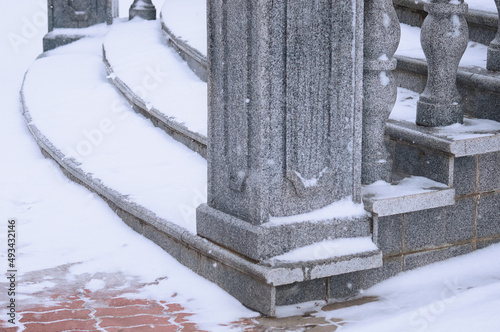 A close view of the granite steps under the snow. Balustrade sta photo