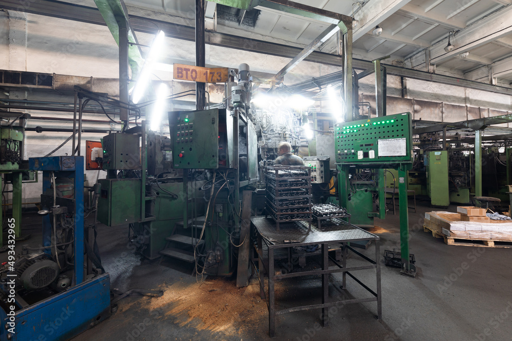 The interior of a big industrial building of factory with steel constructions. Plant of car production. Industrial and machinery concept The interior of a big industrial building of factory with steel constructions. Plant of car production. Industrial and machinery concept
