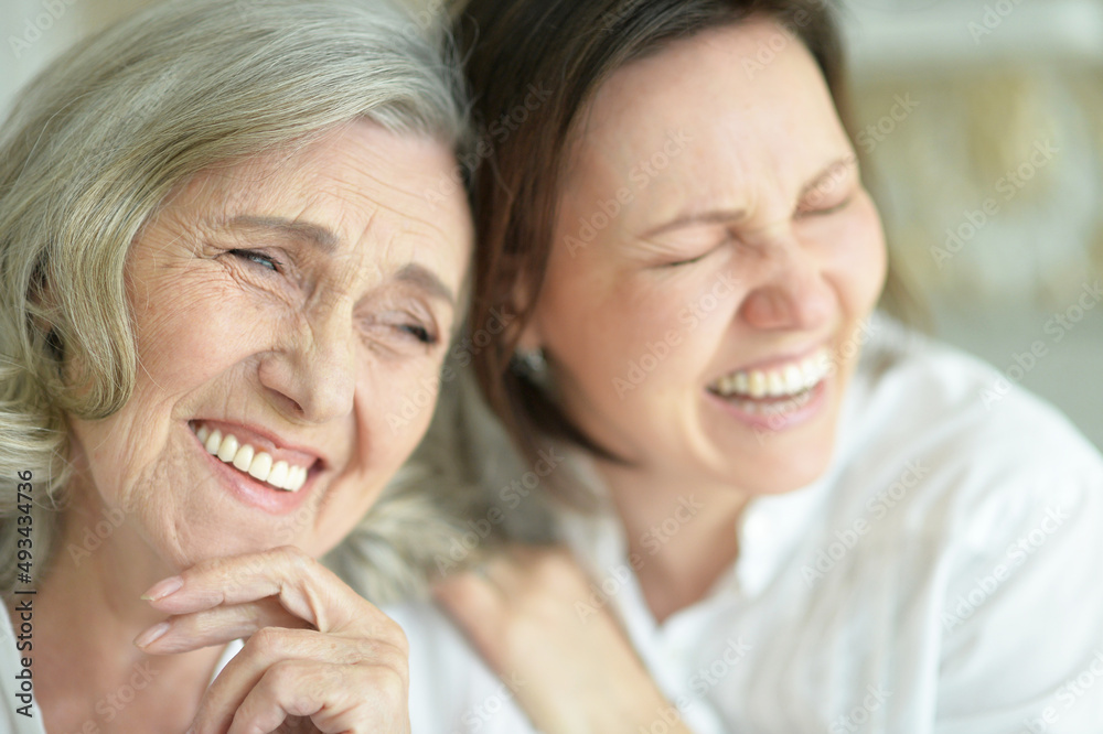 Portrait of Senior woman with daughter at home