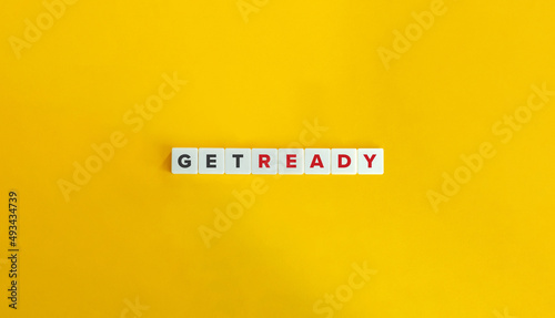 Get Ready Phrase on Letter Tiles on Yellow Background. Minimal Aesthetics.