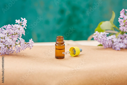 Face care cosmetic - pipette dropper: multitasking beauty products. Minimalism concept, polytasking functions. Natural eco forest moss. Dermatology cosmetics. photo