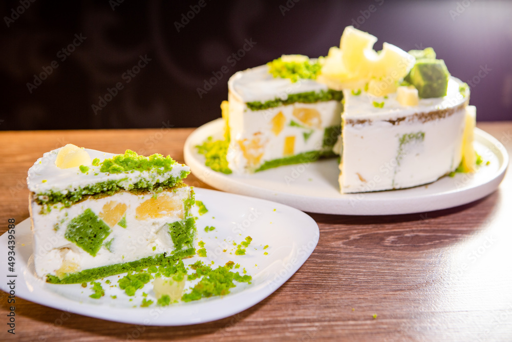 a piece of airy cake with citrus sponge and pineapple slices a piece of airy cake with citrus sponge and pineapple slices