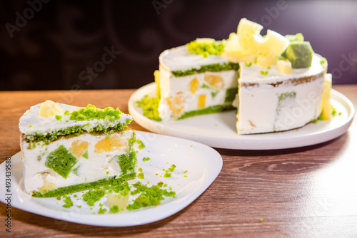 a piece of airy cake with citrus sponge and pineapple slices