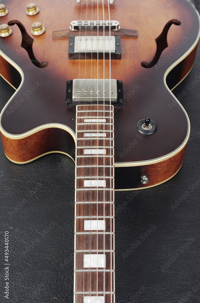 Fototapeta premium Jazz electric guitar on a dark background. 