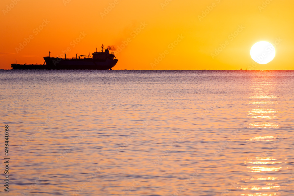 Tanker ship at sunset