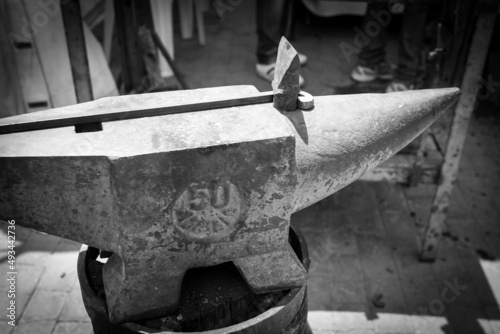 Greyscale image of an old anvil