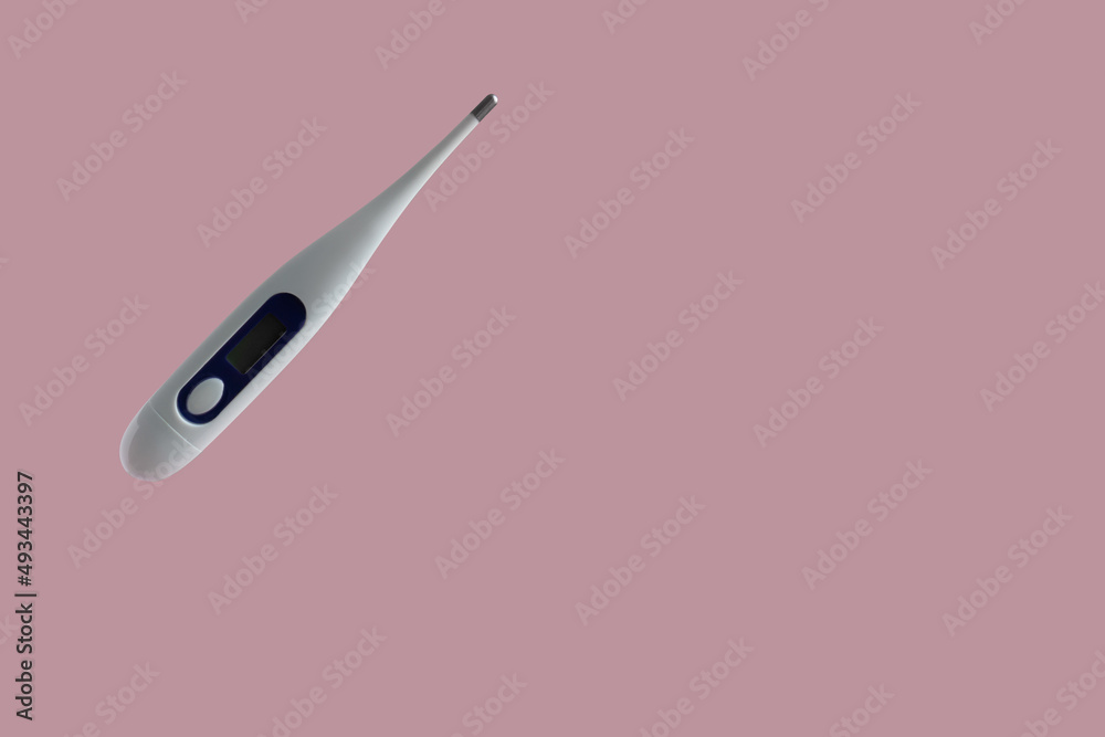 one thermometer floating in the air levitation on a pink background one thermometer floating in the air levitation on a pink background