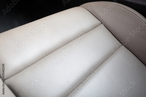 Close up view of modern car leather seat at the luxury interior