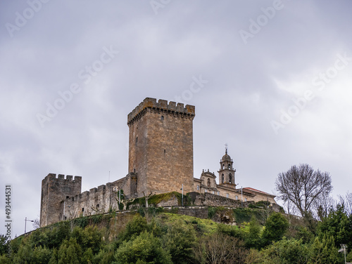 Bottom view of Castle of Monforte de Lemos, located on a small hill in a valley. View of the wall, the homage tower, the Count's Palace and the Monastery photo