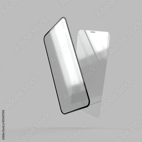 Two protective tempered glass for smartphone display on a gray background.  photo