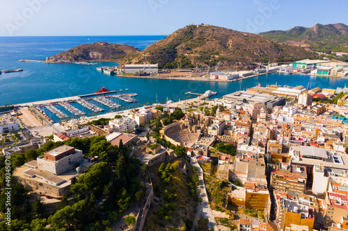 Aerial view of cityscape and marina of Spanish city of Cartagena in sunny summer day, Region of Murcia